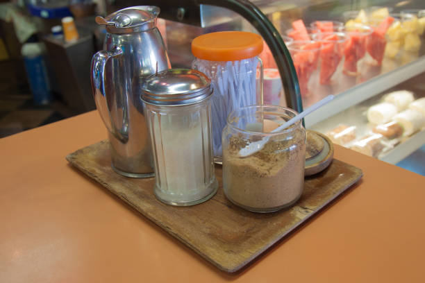 istock Cream and sugar in glass bottle at coffee shop 657837340
