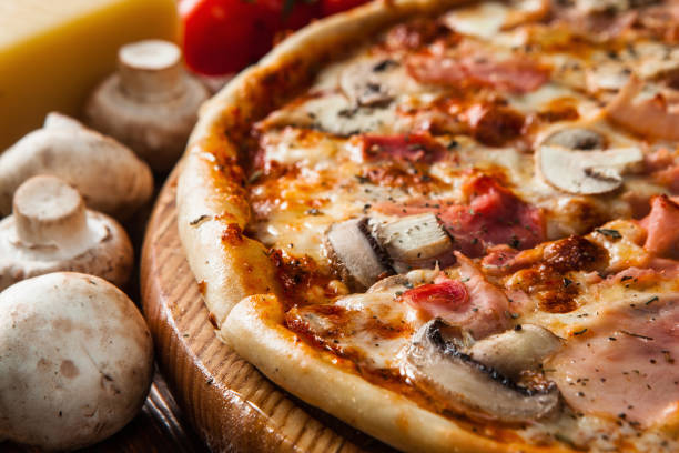 istock Fresh italian pizza served on wood table close up 657837342