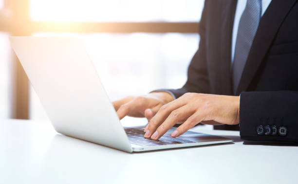 istock Close-Up Of Man Using Laptop On Table 657843506