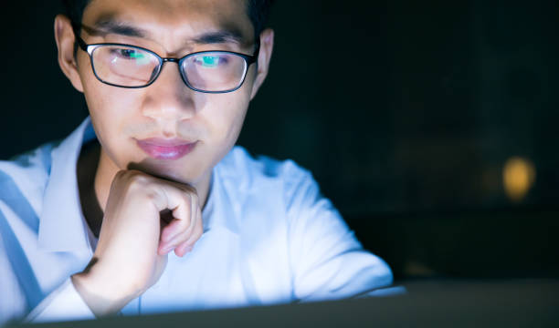 istock Businessman working on laptop at night 657844050