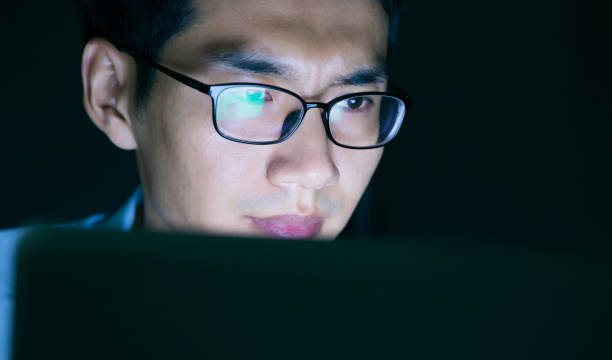 istock Businessman working on laptop at night in office 657844086