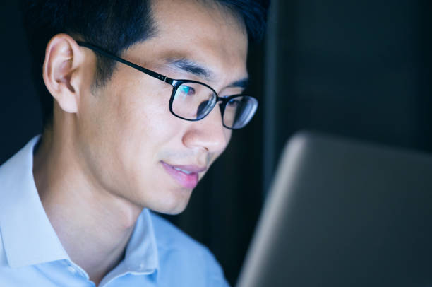 istock Businessman working on laptop at night in office 657844132