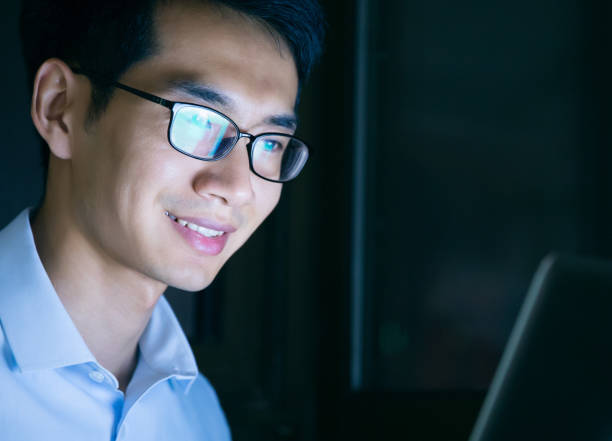 istock Businessman working on laptop at night in office 657844250