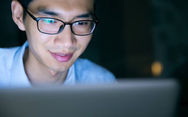 istock Businessman working on laptop at night in office 657844262