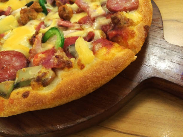 istock Delicious pizza Serve hot wooden pan 657846746