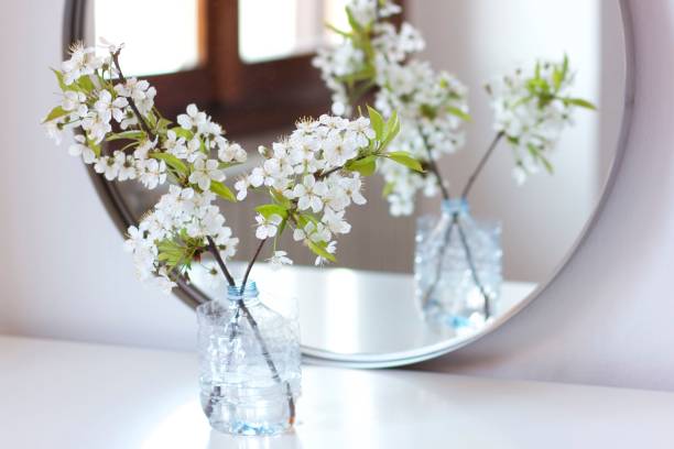 istock White flowers in a bottle pot 657846982