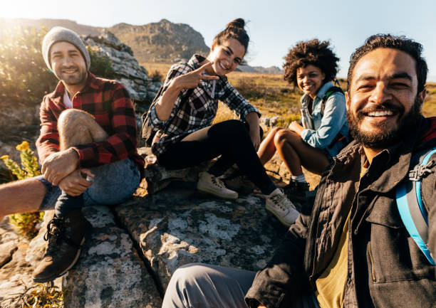 istock Hikers relaxing and taking selfie 657847692