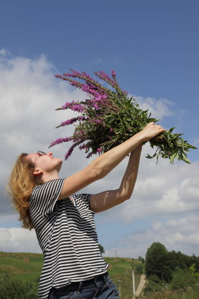 istock Woman with bouquet in a mountains. 657847766