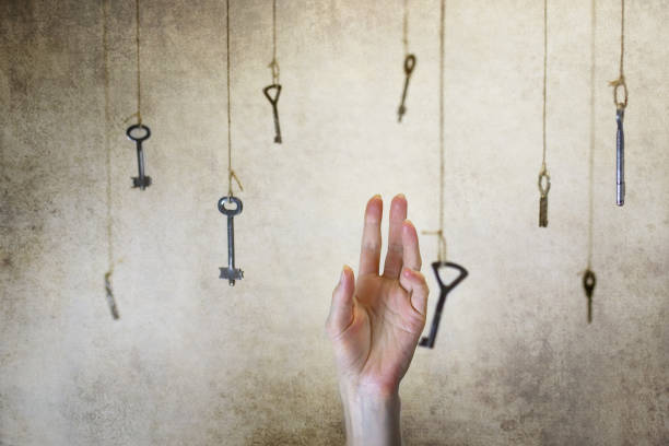 istock hand stretching for one of the many old vintage keys 657848242