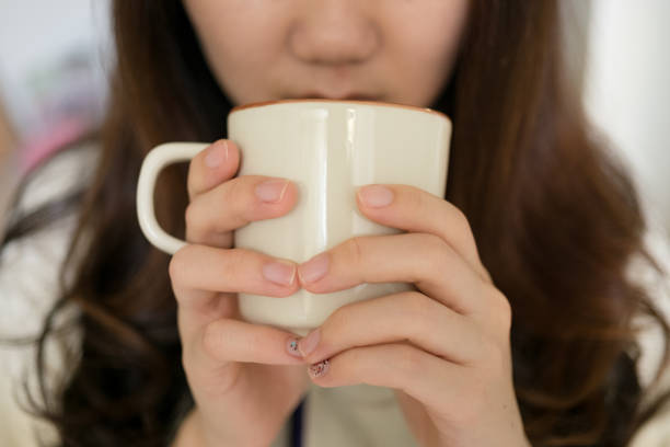 istock Girl holding coffee cup 657851080