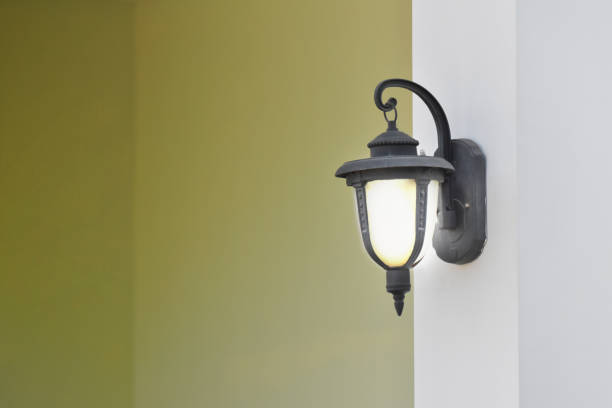 istock Install the wall lamp poles, house white and yellow background. 657852004