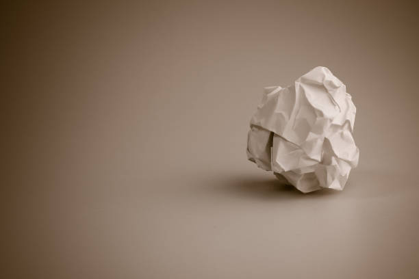 istock Crumpled paper ball, rejection and failure idea background with copy space. 657857152