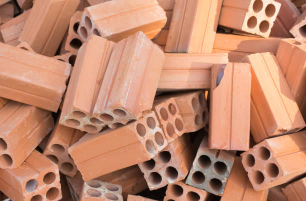 istock Group of Red bricks clay for construction in sun light 657857368