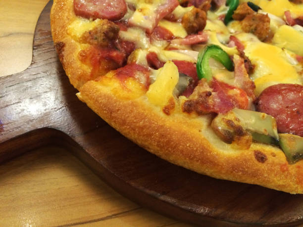 istock Delicious pizza Serve hot wooden pan 657857510
