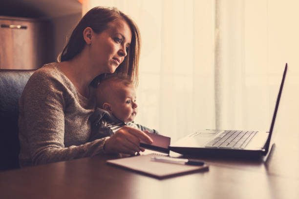 istock Single mother working from home with her baby boy 657857800