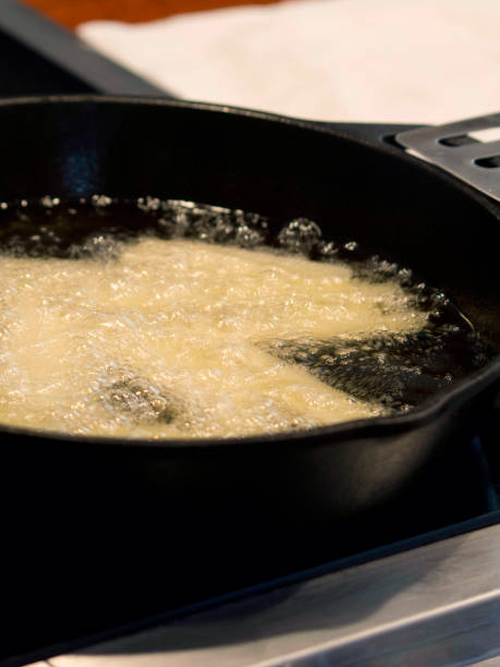istock Potato Being Fried in Cast Iron Skillet 657858202