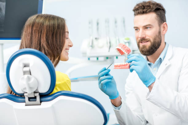 istock Dental consultation with jaw model 657868788