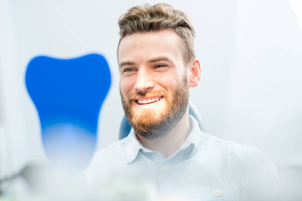 istock Man with great smile at the dental office 657869220