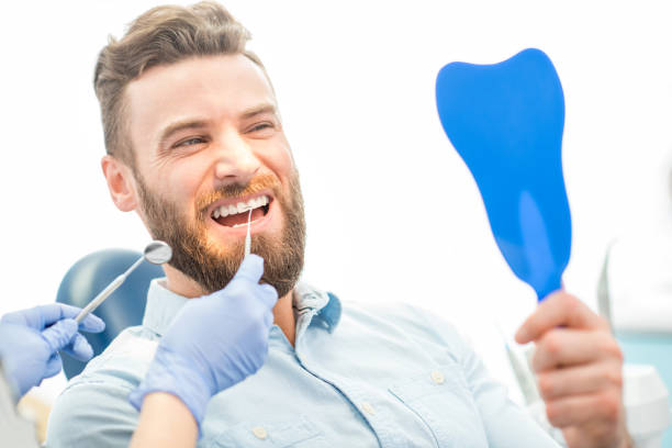 istock Man with great smile at the dental office 657871764