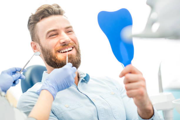 istock Man with great smile at the dental office 657871868