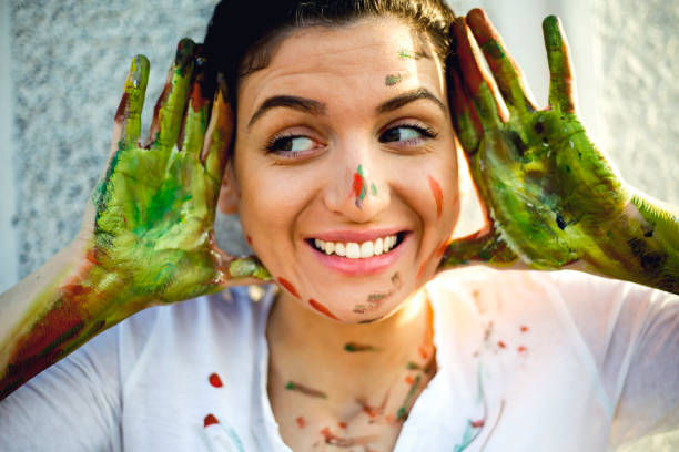 istock Smiling young women have a fun with colors 657874732
