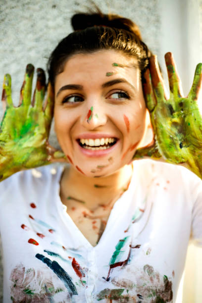 istock Smiling young women have a fun with colors 657874964