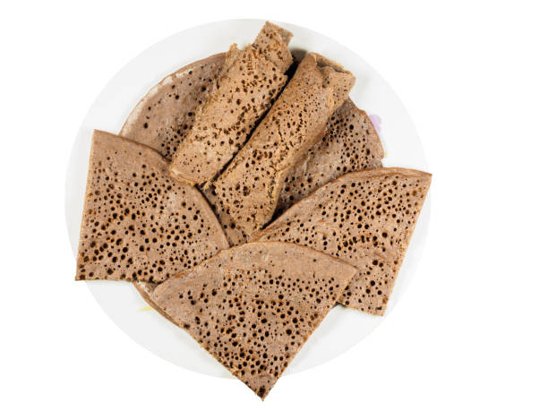 Traditional Ethiopian flatbread from fermented teff flour on a white plate stock photo