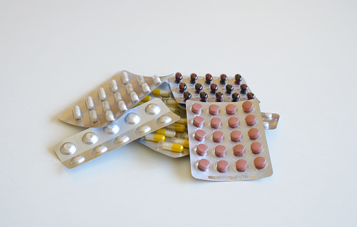 View of the tray of drugs lying in a pile on a white background