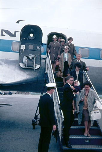 Munich, Bavaria, Germany, 1965. Passenger leaving the plane after landing in Munich. At the time, a gangway was needed as the aircraft were still parked on the airfield.