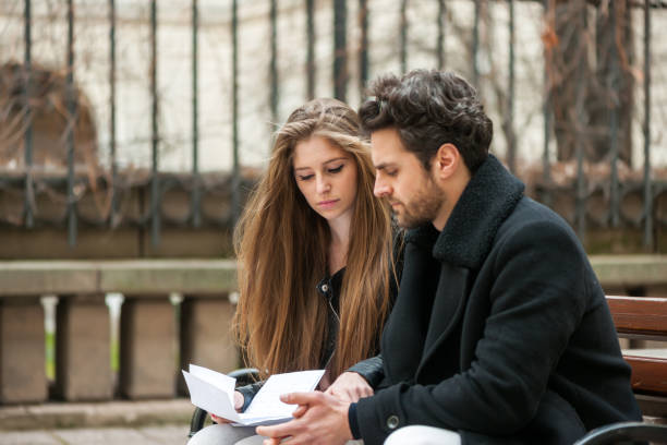 istock Worried couple reading a letter 657881698