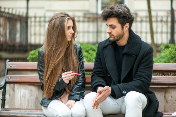 istock Disappointed couple looking at pregnancy test. 657881730
