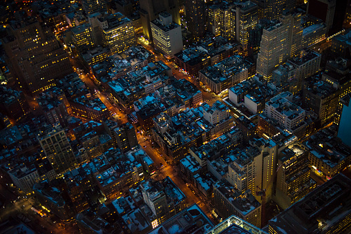 Aerial view of Manhattan in New York City, NY, USA. Horizontal composition. Image taken with Nikon D800 and developed from Raw format. Full frame image. Image taken at night. City is illuminated very well.