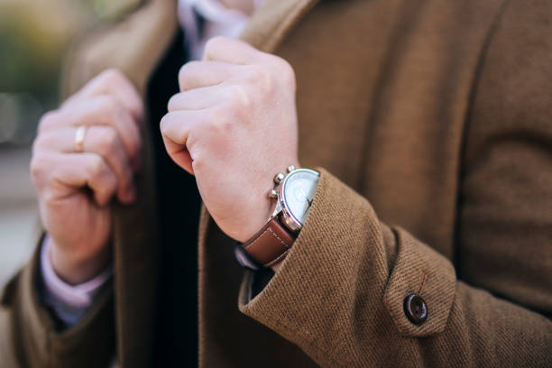 istock Men watches on hand in coat 657887900
