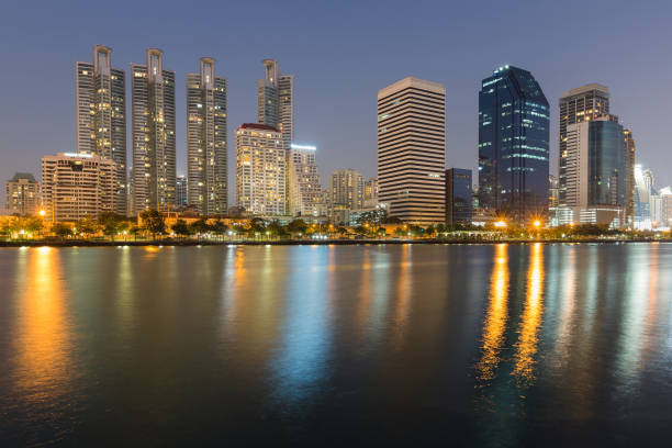 istock Twilight city office building with water reflection 657888318