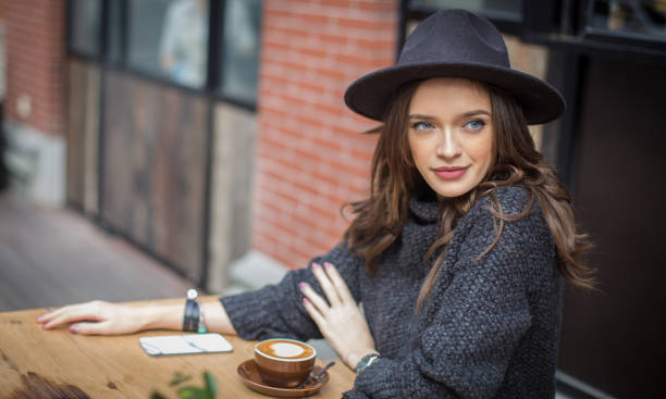 istock Beautiful woman sitting in a cafe 657894624