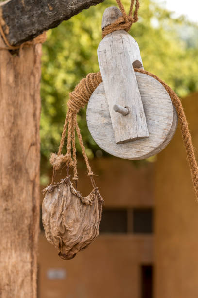 istock Leather bucket, wood pulley 657894742