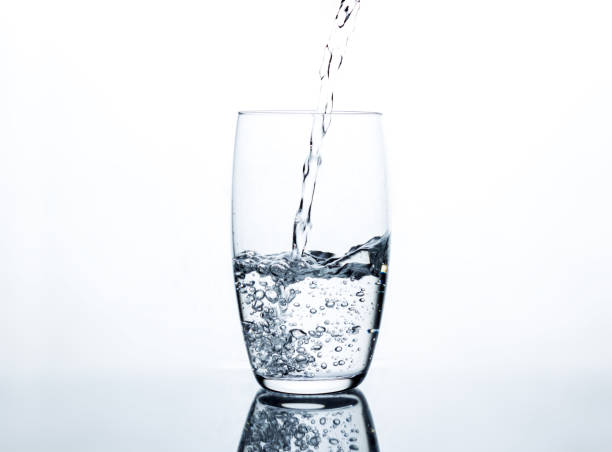 istock Water pouring into clear glass 657900636