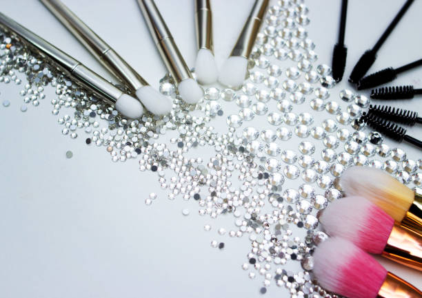 istock Brushes for make-up and precious stones. 657904598