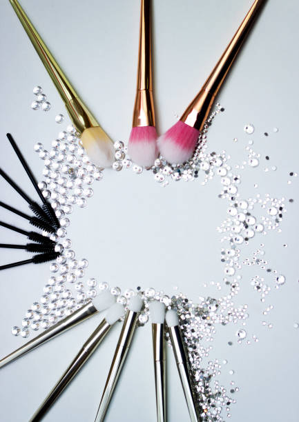 istock Brushes for make-up and precious stones. 657904720