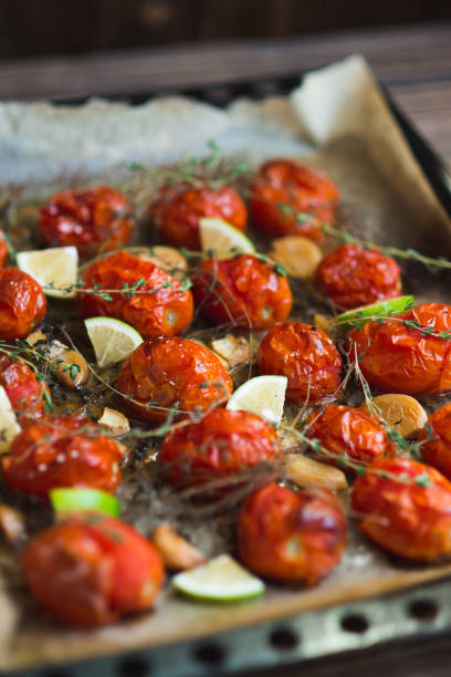 istock Baked tomatoes with thyme and garlic 657911450