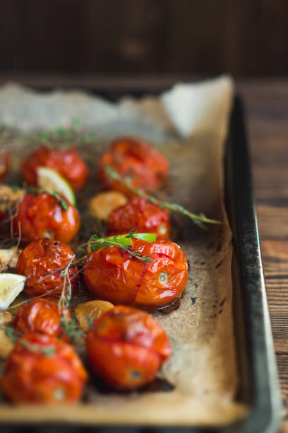 istock Baked tomatoes with thyme and garlic 657911508