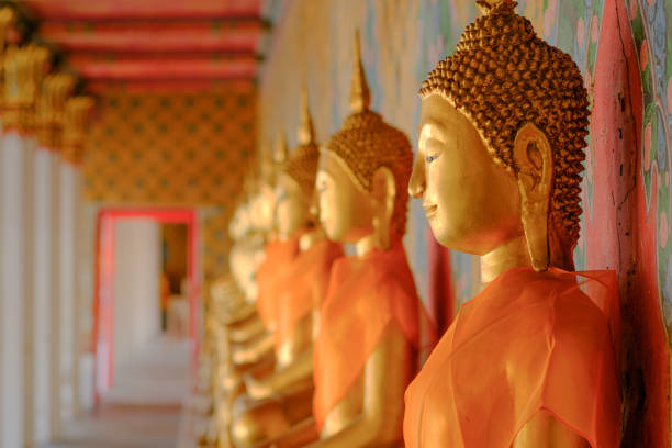 istock Buddha statue at Wat Arun, Bangkok Thailand 657914900