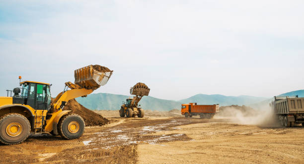 istock Tipper trucks and Loaders in operation (Earthworks ) 657914958