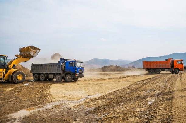 istock Tipper trucks and Loaders in operation (Earthworks ) 657914982