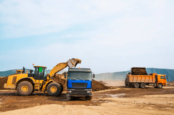 istock Tipper trucks and Loaders in operation (Earthworks ) 657914990