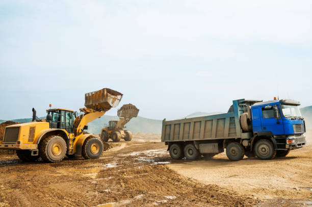istock Tipper trucks and Loaders in operation (Earthworks ) 657915000