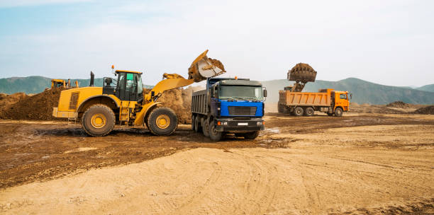 istock Tipper trucks and Loaders in operation (Earthworks ) 657915012