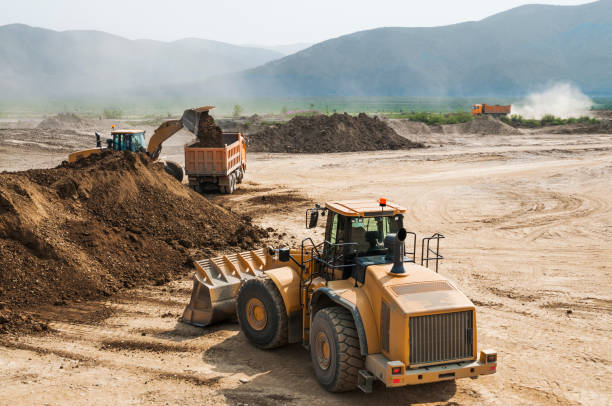 istock Tipper trucks and Loaders in operation (Earthworks ) 657915028