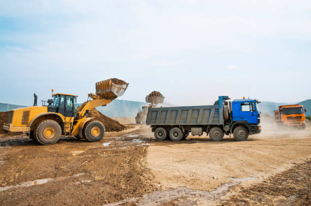 istock Tipper trucks and Loaders in operation (Earthworks ) 657915030