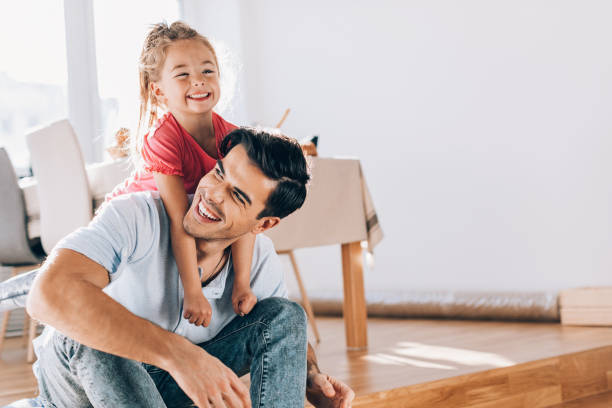 istock Father and daughter playing together 657915046